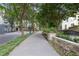 Well-lit sidewalk offering a serene, tree-lined path with benches outside the building at 3445 Stratford Ne Rd # 1605, Atlanta, GA 30326