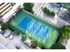 Aerial view of a private tennis court surrounded by landscaped gardens and seating areas at 3445 Stratford Ne Rd # 1605, Atlanta, GA 30326
