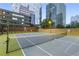 Well-maintained tennis court with net and city views for sports and recreation at 3445 Stratford Ne Rd # 1605, Atlanta, GA 30326