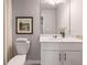 Well-lit bathroom with a modern sink, white cabinets and a decorative painting on the wall at 5615 Hislop Lane # 82, Mableton, GA 30126