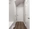 Hallway with hardwood floors and white doors, providing ample storage at 5615 Hislop Lane # 82, Mableton, GA 30126