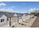 Street view featuring newly constructed townhomes with attached garages and landscaping at 5615 Hislop Lane # 82, Mableton, GA 30126