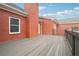 Backyard deck with brick chimney and wood railing, perfect for entertaining at 2984 Berry Rd, Loganville, GA 30052