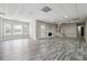 Basement with wood-look flooring, fireplace, staircase, and ample space for customization at 2984 Berry Rd, Loganville, GA 30052