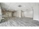 Spacious finished basement featuring gray wood-look floors and recessed lighting, perfect for entertaining at 2984 Berry Rd, Loganville, GA 30052