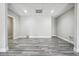 Bright basement with gray wood-look floors and recessed lighting, offering a versatile living space at 2984 Berry Rd, Loganville, GA 30052