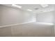 Large open basement with neutral carpet and ample lighting, ready for customization and comfort at 2984 Berry Rd, Loganville, GA 30052