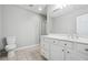 A clean bathroom has a single vanity, toilet, and glass shower, finished with tile flooring at 2984 Berry Rd, Loganville, GA 30052