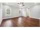 Spacious bedroom with hardwood floors, neutral paint, and plenty of natural light at 2984 Berry Rd, Loganville, GA 30052