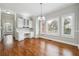 Bright dining area with natural light, built-in cabinets, and hardwood floors at 2984 Berry Rd, Loganville, GA 30052