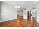 Open dining area with hardwood floors and a view into the kitchen at 2984 Berry Rd, Loganville, GA 30052