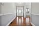 Bright foyer with hardwood floors and a decorative front door at 2984 Berry Rd, Loganville, GA 30052