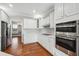 Kitchen featuring stainless double oven and a stylish backsplash at 2984 Berry Rd, Loganville, GA 30052