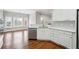 Bright kitchen featuring white cabinets, stainless appliances, and eat-in area at 2984 Berry Rd, Loganville, GA 30052