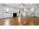 Bright living room with hardwood floors, a fireplace, and a ceiling fan at 2984 Berry Rd, Loganville, GA 30052