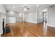 Spacious living room with hardwood floors, a fireplace, and natural light at 2984 Berry Rd, Loganville, GA 30052
