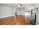 Large living room with hardwood floors, fireplace, and open access to kitchen at 2984 Berry Rd, Loganville, GA 30052