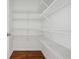Walk-in pantry with ample shelving for organized storage at 2984 Berry Rd, Loganville, GA 30052