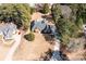 Expansive aerial view of beautiful home with large yard, mature trees, and sparkling backyard pool at 330 Todwick Dr, Roswell, GA 30075