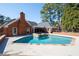 Gorgeous pool and spa in a private backyard setting of the brick home at 330 Todwick Dr, Roswell, GA 30075