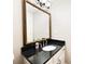 Elegant bathroom vanity with granite countertop, mirror, and framed mirror at 330 Todwick Dr, Roswell, GA 30075