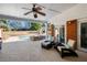 Beautiful outdoor living space with fireplace, pool views, and comfortable lounge chairs at 330 Todwick Dr, Roswell, GA 30075