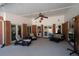 Inviting covered patio with ceiling fan, brick columns, and comfortable seating area at 330 Todwick Dr, Roswell, GA 30075
