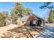 Charming brick home with well-manicured lawn, mature trees, and inviting curb appeal at 330 Todwick Dr, Roswell, GA 30075