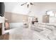Living room featuring a brick fireplace, soaring ceilings, and plush white reclining sofa at 330 Todwick Dr, Roswell, GA 30075