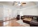 Cozy living room with hardwood floors, neutral walls, and comfortable leather furniture at 330 Todwick Dr, Roswell, GA 30075