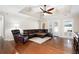 Comfortable living room featuring hardwood floors, tray ceiling, and access to the backyard at 330 Todwick Dr, Roswell, GA 30075