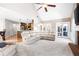 Open concept living room featuring soaring ceilings and views into the kitchen and breakfast nook at 330 Todwick Dr, Roswell, GA 30075