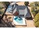 Aerial shot showcasing a private pool and spa with an outdoor fireplace in a fenced backyard at 330 Todwick Dr, Roswell, GA 30075