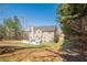 Large backyard featuring a patio, lush lawn, and exterior view of the house, great for outdoor living at 9225 Wilshire Pl, Cumming, GA 30028