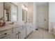 Elegant bathroom with dual vanities, marble countertops, and ample storage space at 9225 Wilshire Pl, Cumming, GA 30028