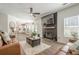 Spacious living room features hardwood floors and fireplace at 9225 Wilshire Pl, Cumming, GA 30028