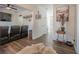 Cozy living room featuring a ceiling fan, hard flooring, and an open layout great for entertaining at 9225 Wilshire Pl, Cumming, GA 30028