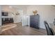 Spacious home office featuring an open layout, bright walls, and modern laminate flooring at 9225 Wilshire Pl, Cumming, GA 30028