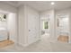 Hallway featuring access to laundry room, bathroom, and a bedroom at 8523 Poston Place Lot 132, Douglasville, GA 30134