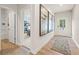 Inviting foyer with wood floors, modern art, and access to bathroom and other rooms at 8523 Poston Place Lot 132, Douglasville, GA 30134