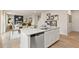 Stylish kitchen island with stainless steel appliances, open to living and dining areas at 8523 Poston Place Lot 132, Douglasville, GA 30134