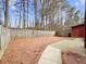 Spacious backyard features level ground with partial patio and privacy fencing at 1310 Shiloh Nw Ter, Kennesaw, GA 30144