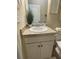 Half bathroom with a vanity, light countertops, decorative wall hangings, and white trim at 3624 Peeksville Rd, Locust Grove, GA 30248