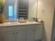 Bathroom vanity with double sinks, a large mirror, and ample counter space with modern faucets at 3624 Peeksville Rd, Locust Grove, GA 30248