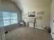 Bright bedroom featuring carpeted floor, neutral colors, decor art, and a window at 3624 Peeksville Rd, Locust Grove, GA 30248
