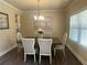 Dining room featuring wood floors, neutral paint, and a wooden table at 3624 Peeksville Rd, Locust Grove, GA 30248