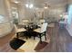 Open-concept kitchen featuring a breakfast nook with chairs, and hardwood flooring at 3624 Peeksville Rd, Locust Grove, GA 30248