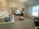 Cozy living area with plush sofa, a round coffee table, and open view to the main bedroom at 3624 Peeksville Rd, Locust Grove, GA 30248