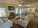 Open-concept living area with fireplace, hardwood floors, and connected kitchen and dining area at 3624 Peeksville Rd, Locust Grove, GA 30248