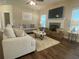 Cozy living room with fireplace, hardwood floors, and neutral wall paint at 3624 Peeksville Rd, Locust Grove, GA 30248